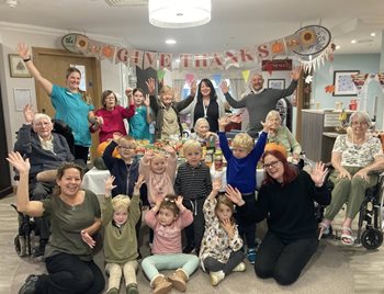 Witney care home residents and nursery children join forces for Harvest Festival fun