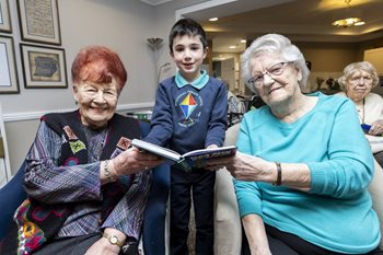 Cardiff care home residents joined by local youngsters for World Book Day