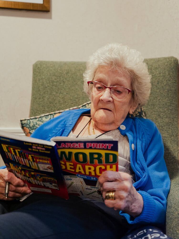 Llys Cyncoed - Llys Cyncoed resident reading