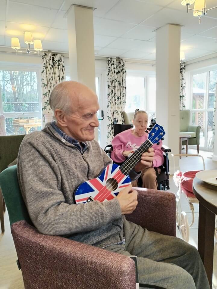 Business Administrator - Pinetum resident playing music